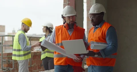 Multiethnic two men co-workers, builder with architect disputing about Stock Footage 124139969