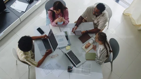 Multiethnic UX Designers Discussing Ideas at Office Table Stock Footage 270145050