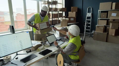 Multiethnic Warehouse Employees Scanning Barcode on Package 動画素材 337306762