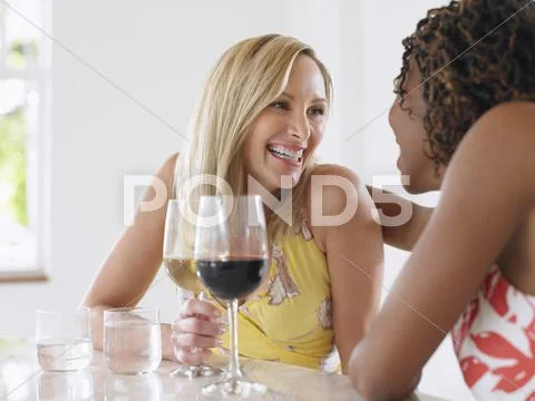 Multiethnic Women Drinking Wine Stock Photos