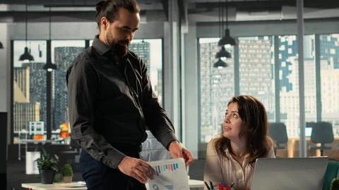 Multiethnic work team collaborates on analytics and forecasting Stock Photos