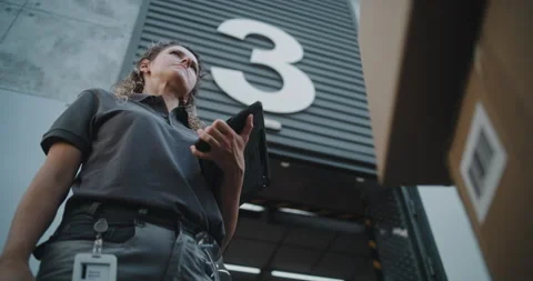 Multiethnic Workers Taking Cardboard Boxes. Female Manager Scanning Parcels Stock Footage 312300693