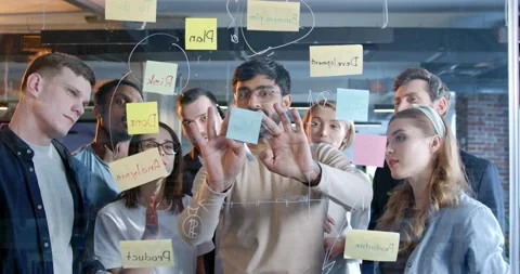 Multiethnic working team making plans for company future and sticking to-do Stock Footage 180046777