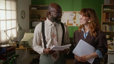 Multiethnic Young Colleagues Collaborating on Retro Business Project Stock Footage 341423783