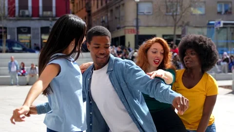 Multiethnic young friends dancing in the city, enjoying party with friends Stock Footage 235906863