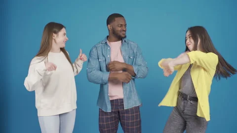 Multiethnic young people dancing, having fun. 動画素材 228810841