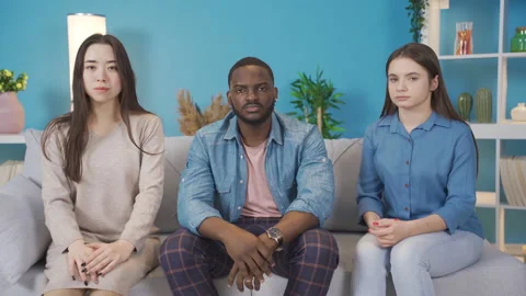 Multiethnic young people looking at camera with dull expression. Stock Footage 228801834