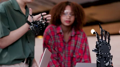 Multiethnic young students concentrate on technology robotics hand mechanis.. Stock Footage 246750413