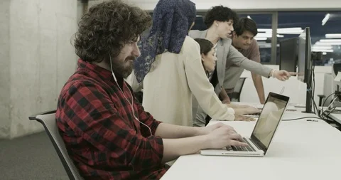 Multiethnics business team of software developers programming together using  Stock Footage 114079736