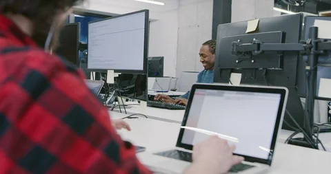Multiethnics business team of software developers programming together using  Stock Footage 114081001