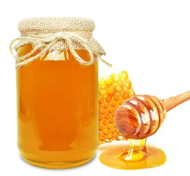 Multiflorous honey in a jar Stock Photos
