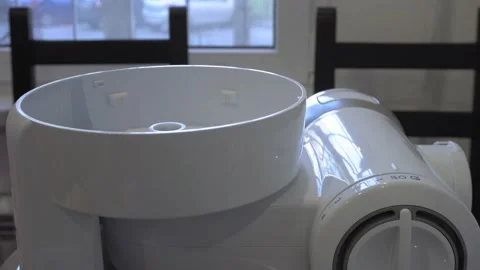 Multifunctional food processor assembly in the kitchen. Blade of electric slicer Stock Footage 130222432