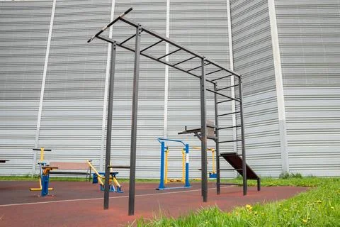 Multifunctional outdoor workout station with pull-up bars and exercise equi.. Stock Photos