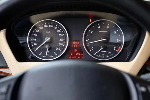 Multifunctional panel of luxury car with speedometer tachometer indicators Stock Photos