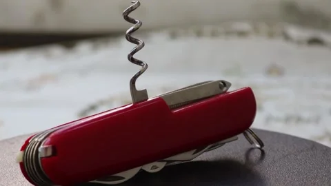 Multifunctional red pocket knife rotates 360 degrees, 4k Stock Footage 248615230