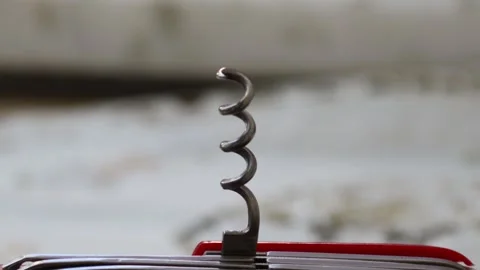 Multifunctional red pocket knife rotates 360 degrees, 4k Stock Footage 248615295