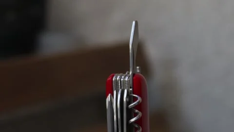 Multifunctional red pocket knife rotates 360 degrees, 4k Stock Footage 248615342