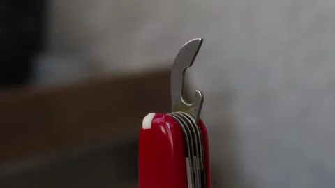 Multifunctional red pocket knife rotates 360 degrees, 4k Stock Footage 248615608