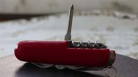 Multifunctional red pocket knife rotates 360 degrees, 4k Stock Footage 248615618