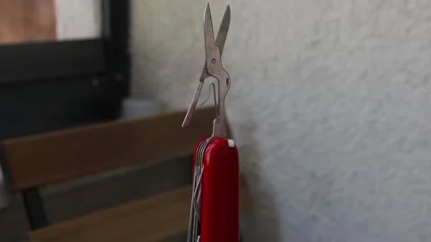 Multifunctional red pocket knife rotates 360 degrees, 4k Stock Footage 248615661