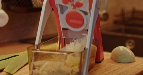 A multifunctional slicer cutting onion Stock Footage 264585155