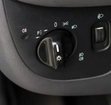 Multifunctional switch of light and dimensions in the car Stock Photos