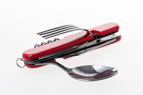 Multifunctional tool includes knife, spoon, fork, bottle opener, corkscrew Stock Photos
