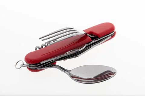 Multifunctional tool includes knife, spoon, fork, bottle opener, corkscrew Stock Photos