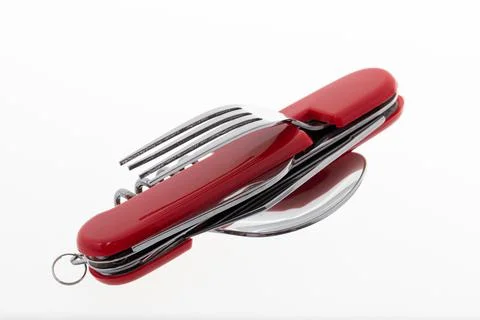 Multifunctional tool includes knife, spoon, fork, bottle opener, corkscrew Stock Photos