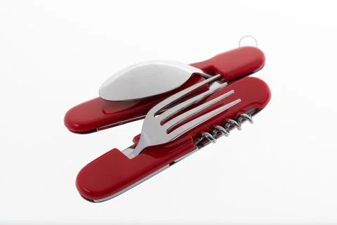 Multifunctional tool includes knife, spoon, fork, bottle opener, corkscrew Stock Photos
