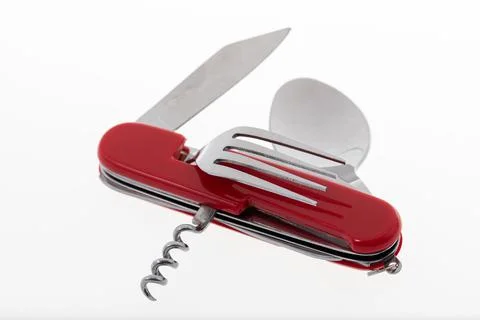 Multifunctional tool includes knife, spoon, fork, bottle opener, corkscrew Stock Photos