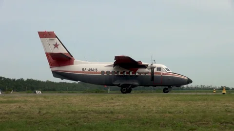 Multifunctional twin-engine turbojet L-410 landed on concrete runway. Stock Footage 121136168