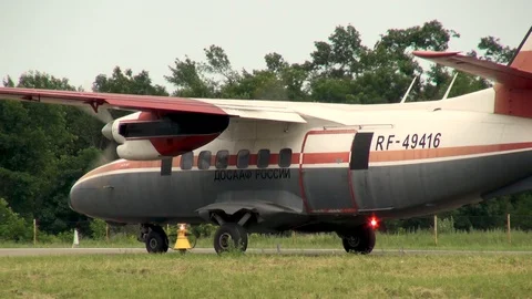 Multifunctional twin-engine Turbolet L-410 taxiing along runway. Stock Footage 121203697