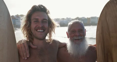 Multigeneration family having fun while surfing on the beach Vídeo Stock 151685719
