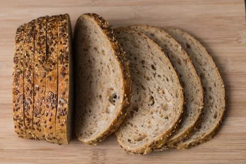Multigrain bread on cutting board Stock Photos