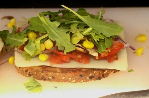 Multigrain bread  with mozzarella cheese, tomato, lettuce and corn Stock Photos