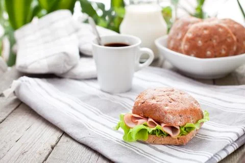 Multigrain bread roll with cup of coffee on the  table Stock-Fotos