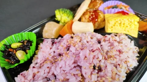 Multigrain rice bento close up, rotating Video stock 309429619