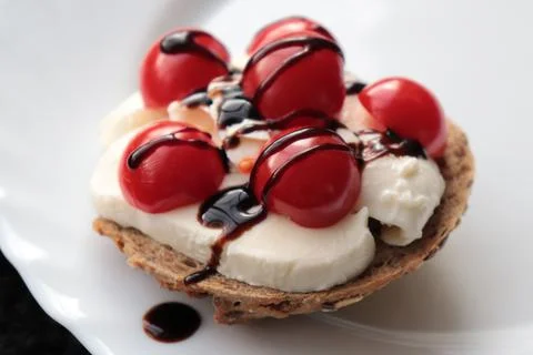 Multigrain rolls with mozzarella, cherry tomatoes and balsamic vinegar Stock Photos
