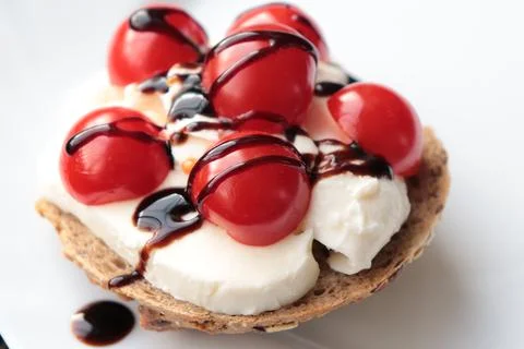 Multigrain rolls with mozzarella, cherry tomatoes and balsamic vinegar Stock Photos
