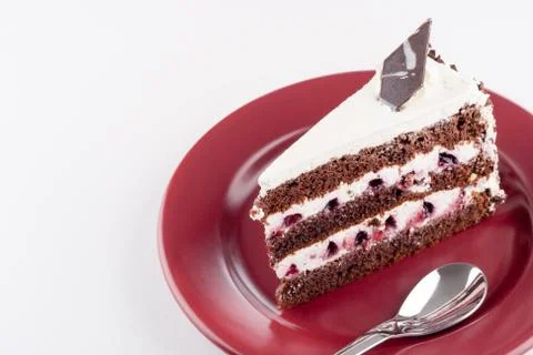 Multilayer cake on plate with spoon Stock Photos