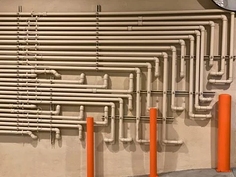 Multilayer pipe construction on the wall Foto stock
