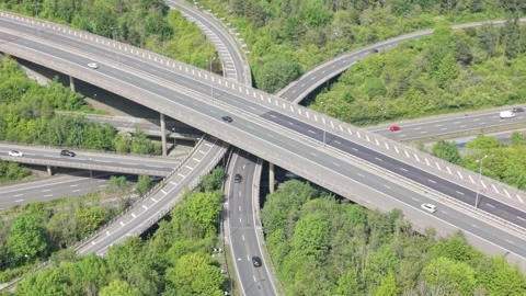 Multilevel Highway Interchange With Active Traffic in a Green Landscape Video stock 336953491
