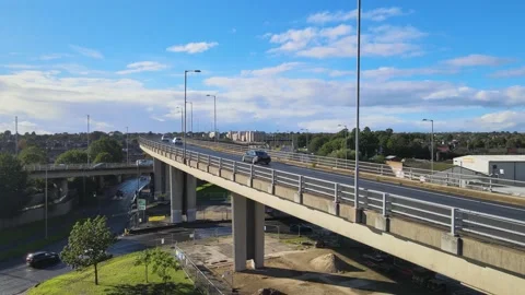 Multilevel road intersection in town, wet glossy road Stock Footage 164817996
