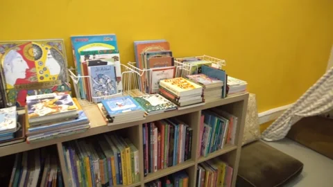 Multilingual children's books in a library - Stock Footage 142071480