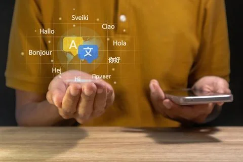 Multilingual language translation concept. Man using a smartphone to transl.. Stock Photos