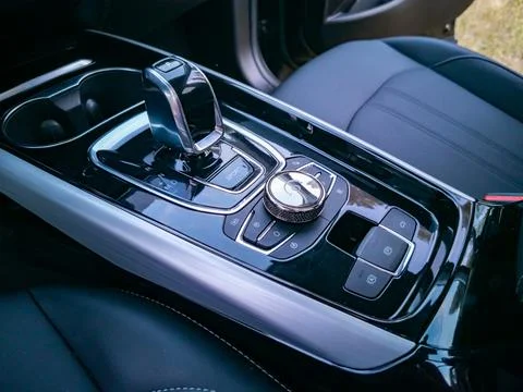 Multimedia system control and gearshift in interior of modern premium car Stock Photos