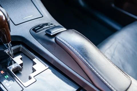 Multimedia system with control buttons and gearshift lever close-up on the ce Stock Photos