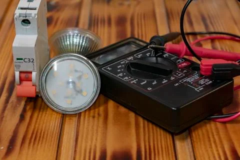 A multimeter is a measuring device of electricity. LED lamp Stock Photos