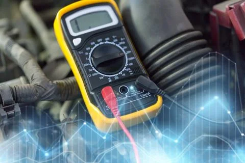 Multimeter or voltmeter testing car battery Stock Photos